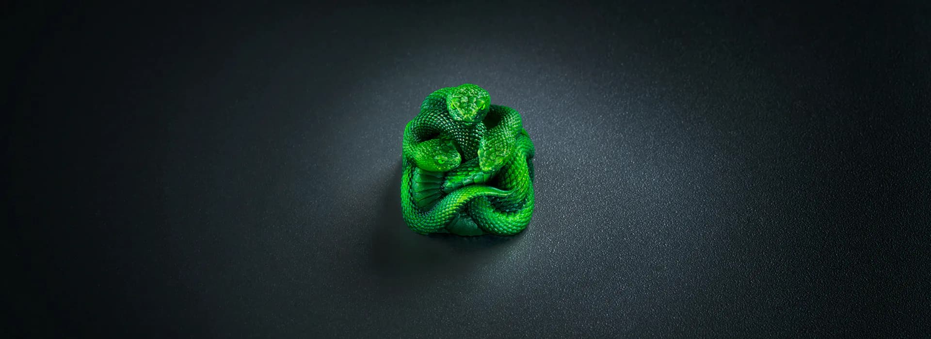 Razer Artisan Keycap Triple Headed Snake Edition — Three Snake Heads Perched Atop a Keyboard