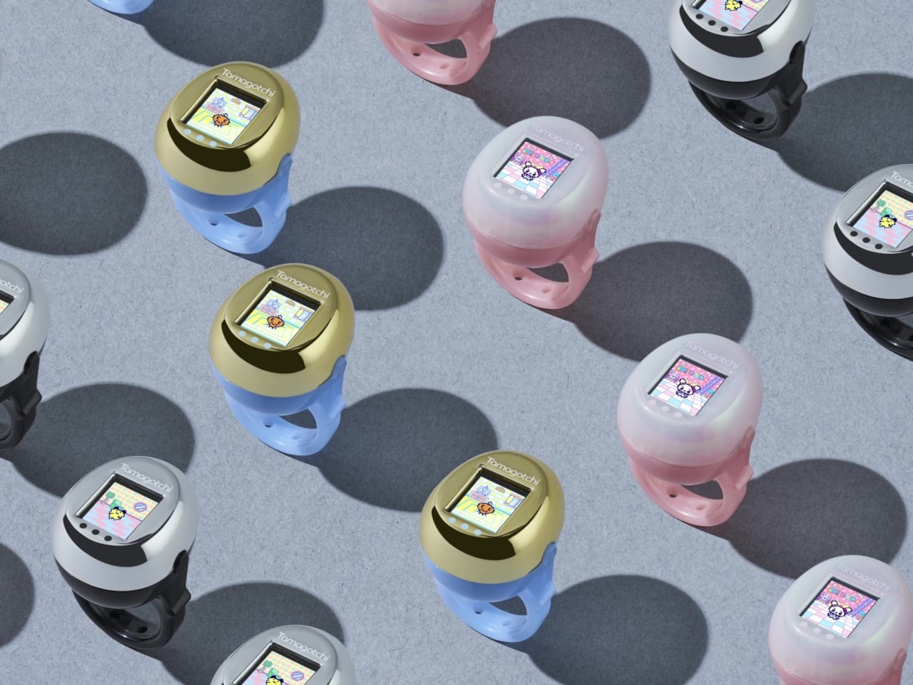 Tamagotchi Ring 컬러별 라인업, 골드·핑크·실버 세 가지 색상이 나란히 놓인 모습