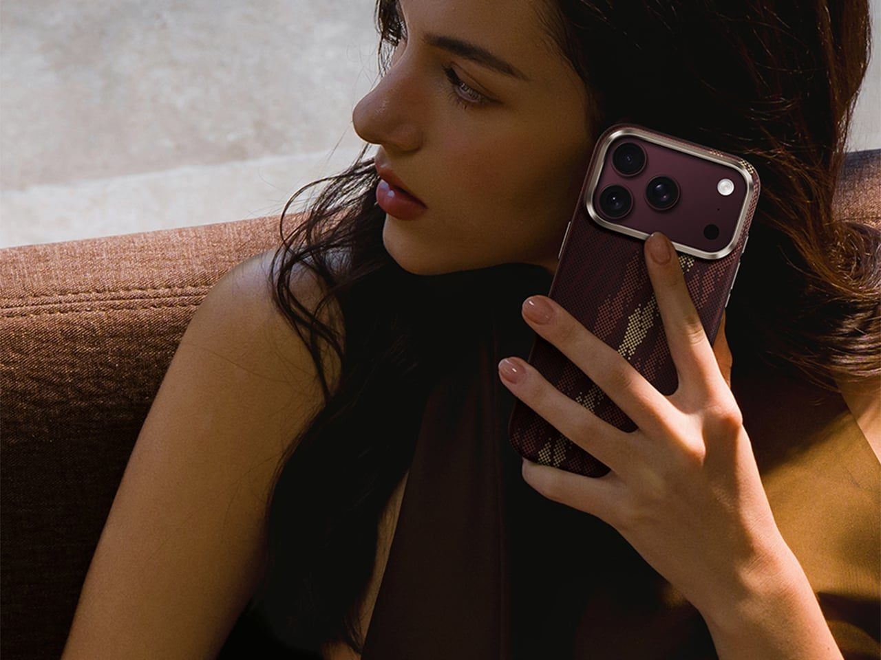 Holding the wine-colored case