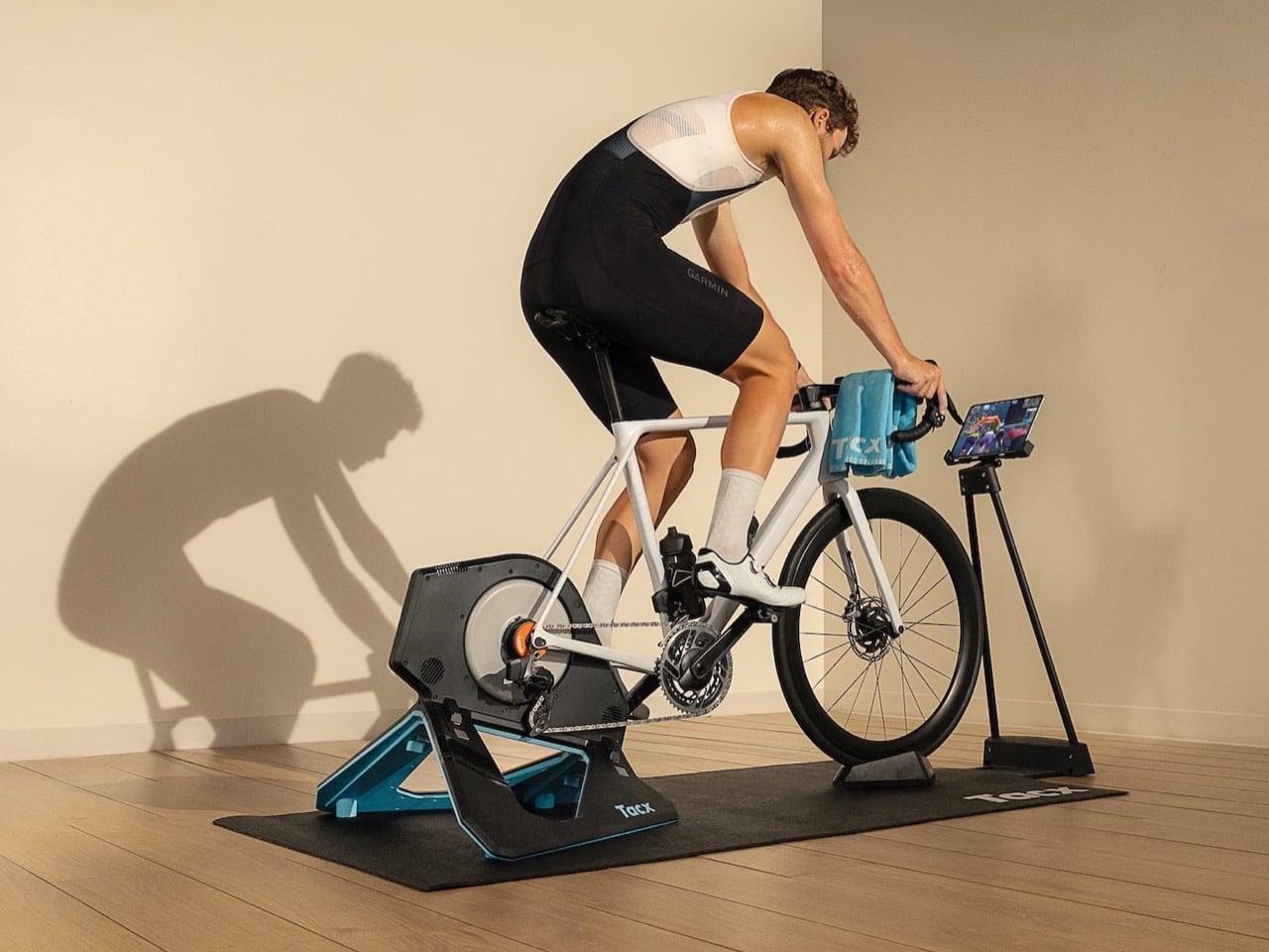 Garmin Tacx Neo 2T main image, a bike mounted on the trainer indoors mid-ride