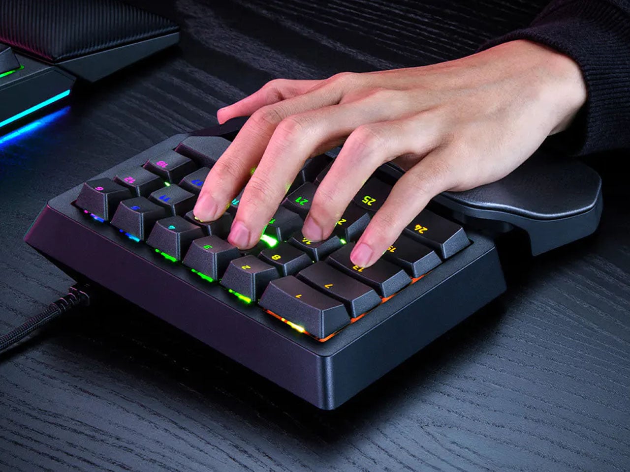 A hand resting on the keypad