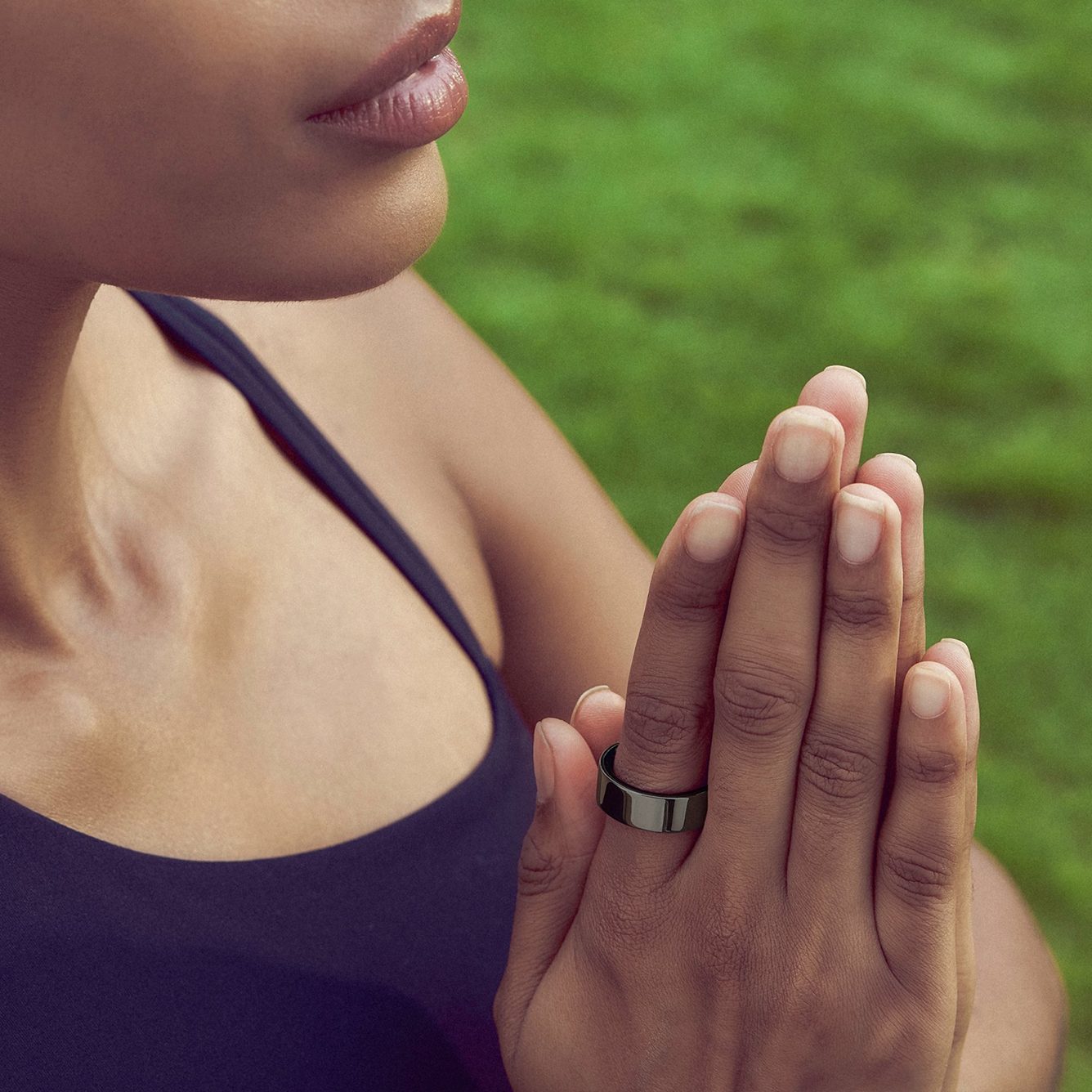Hand wearing the ring in a meditation pose
